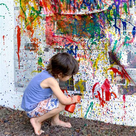 happy little girl spray paint